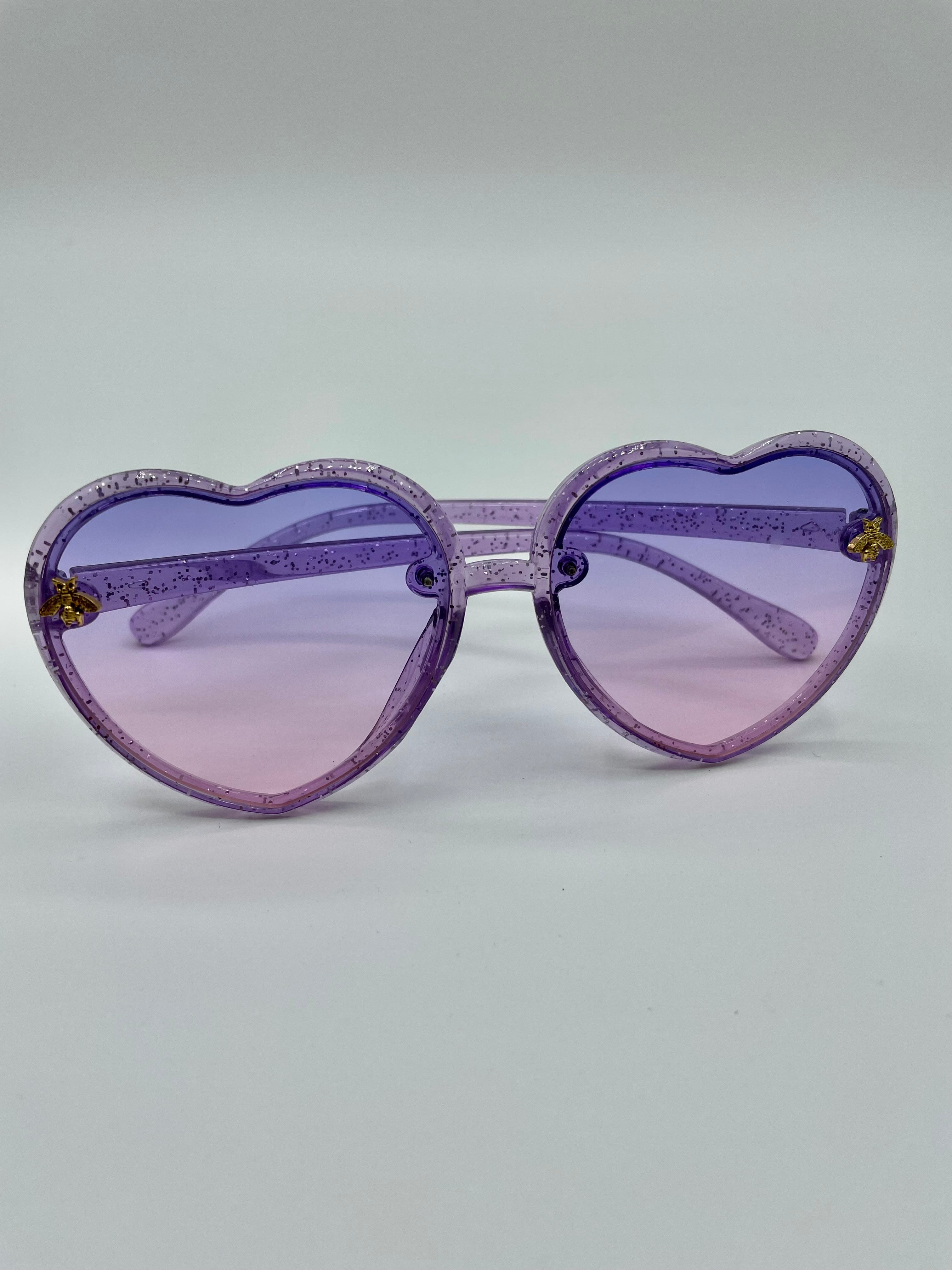 Bright Purple Heart Sunglasses On Violet Background. Woman Accessory For  Summer Vacation. Monochrome Photo Stock Photo, Picture and Royalty Free  Image. Image 181663039.